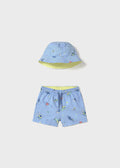 Sett med badeshorts og solhatt blå