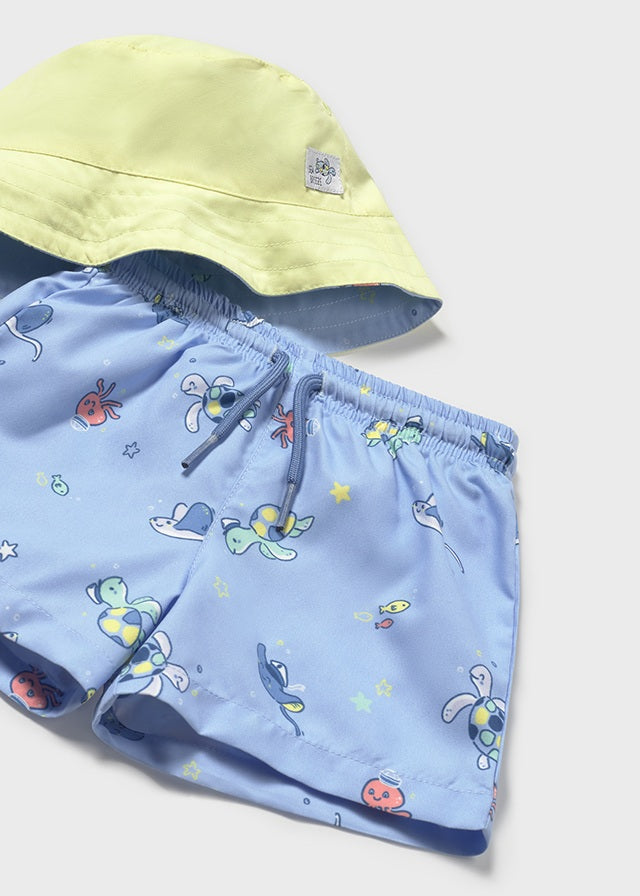 Sett med badeshorts og solhatt blå